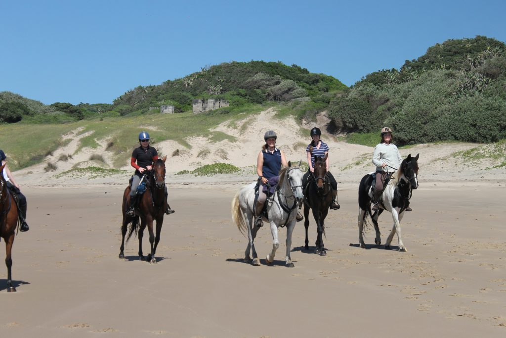 Paardrijden op het strand in Zuid-Afrika